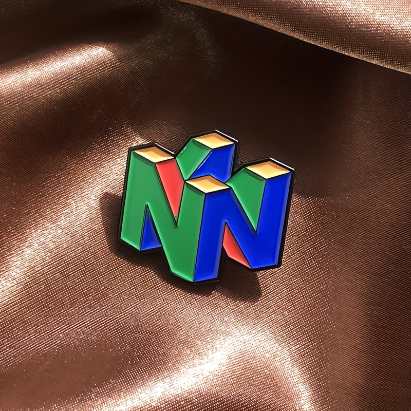 Gaming Console Logo - N64ロゴエナメルピン,レトロゲームコンソール,メタルブローチ,ジャケットバッジ,バッグ,帽子,ファッションアクセサリー,男性へのDIYギフト